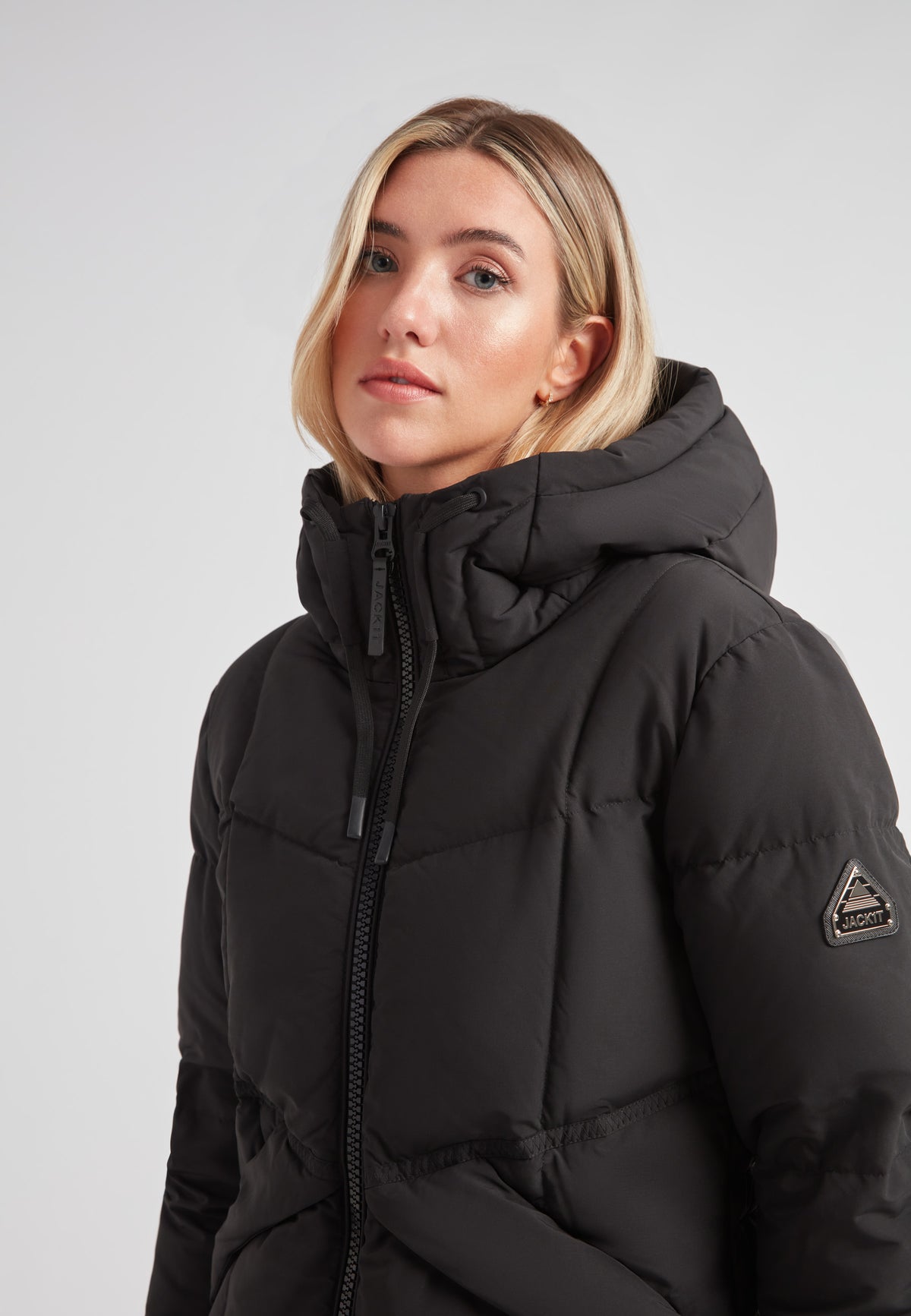 Black Star Puffer Down Coat Black, featuring a hood and sleek design, ideal for cold weather fashion.