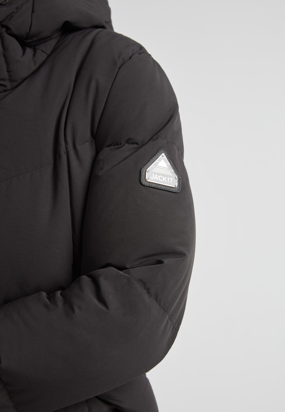 Black Star Puffer Down Coat Black showing sleeve detail and logo on matte black fabric.