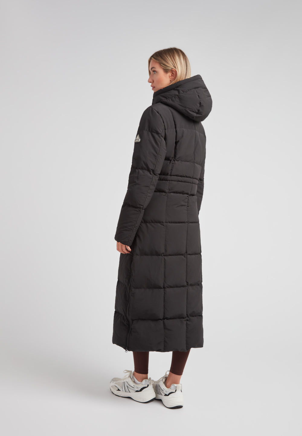 Black Star Extra Long Down Coat Matt Black on model, showcasing the back view with an adjustable hood.