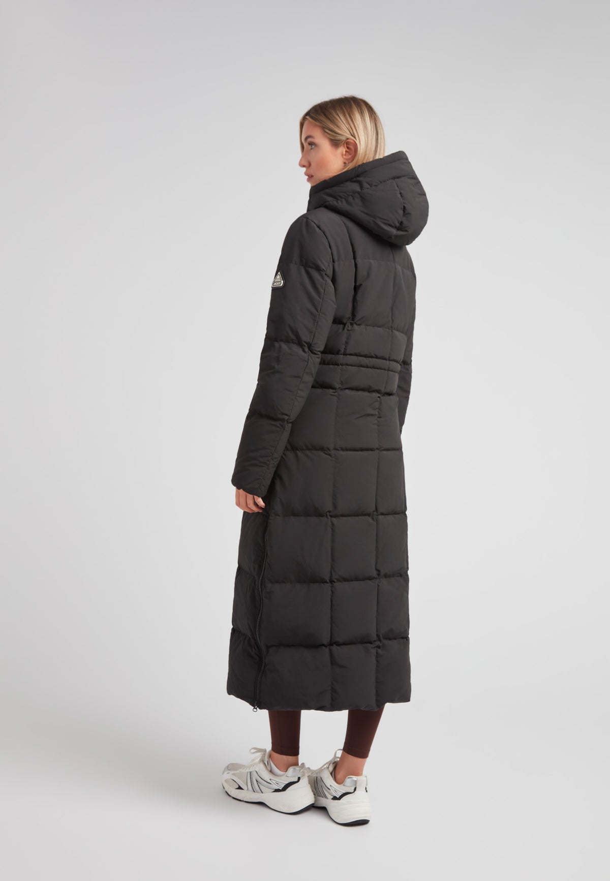 Black Star Extra Long Down Coat Matt Black on model, showcasing the back view with an adjustable hood.
