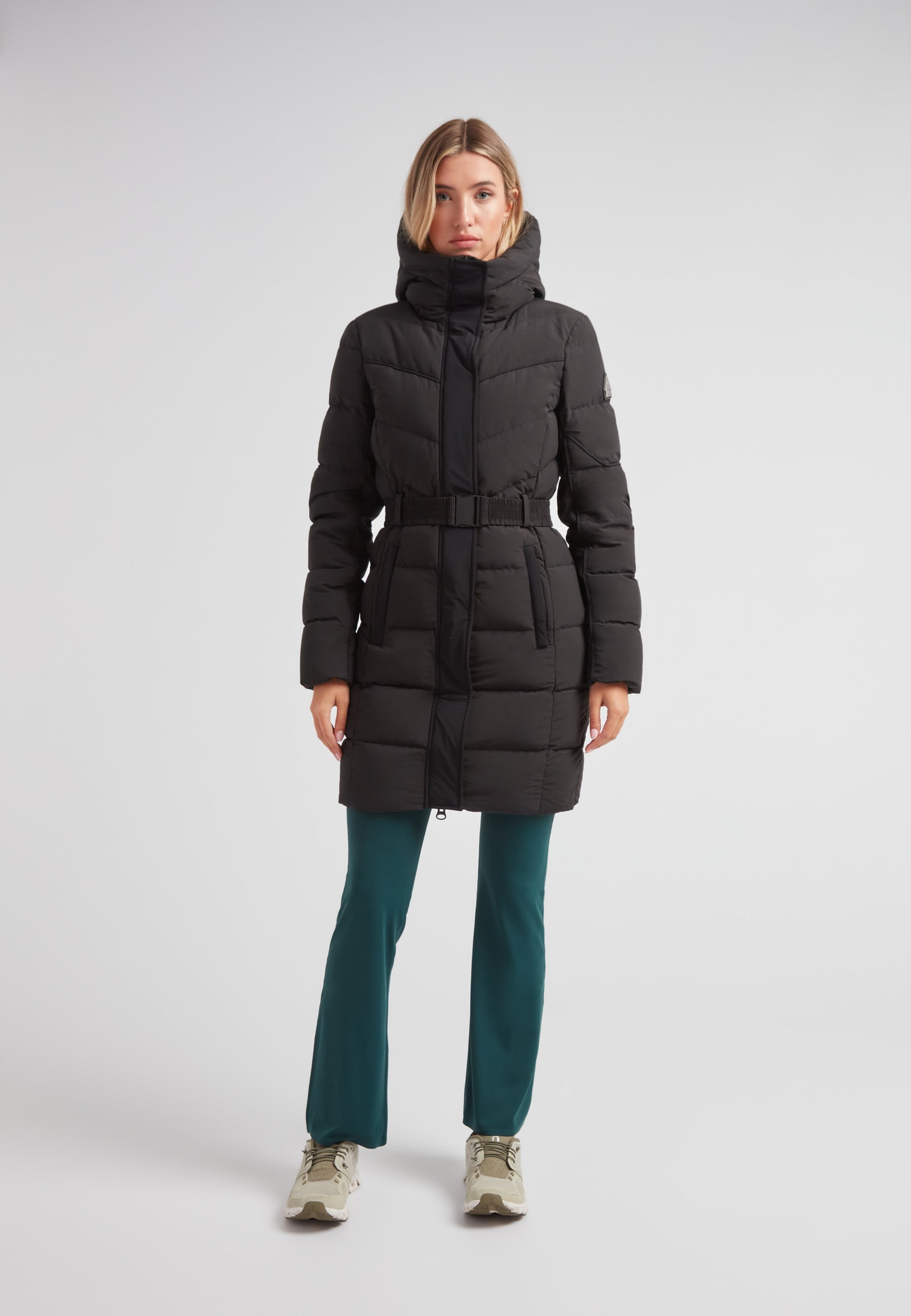 Diamond Belted Down Coat Matt Black worn by a model against a neutral background, showcasing its elegant design.