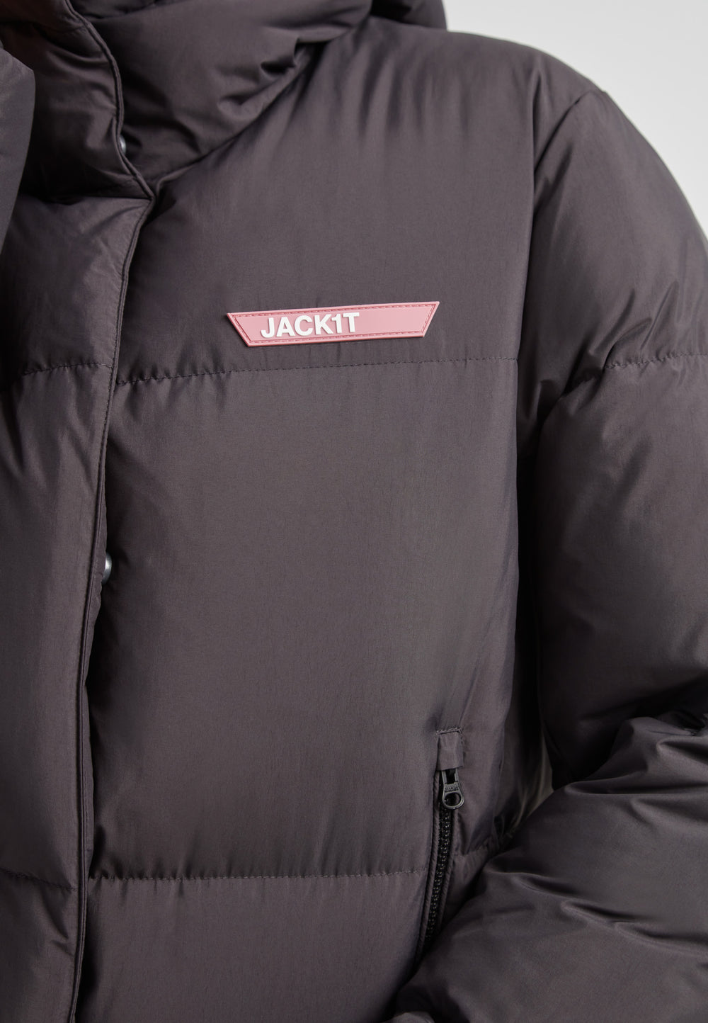 Star Shower Down Puffer Jacket Black featuring a close-up view of the jacket's structure and logo detail.