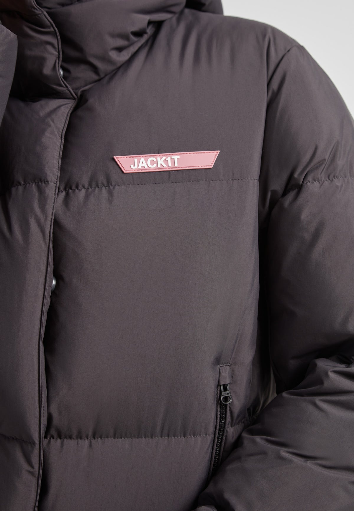 Star Shower Down Puffer Jacket Black featuring a close-up view of the jacket's structure and logo detail.