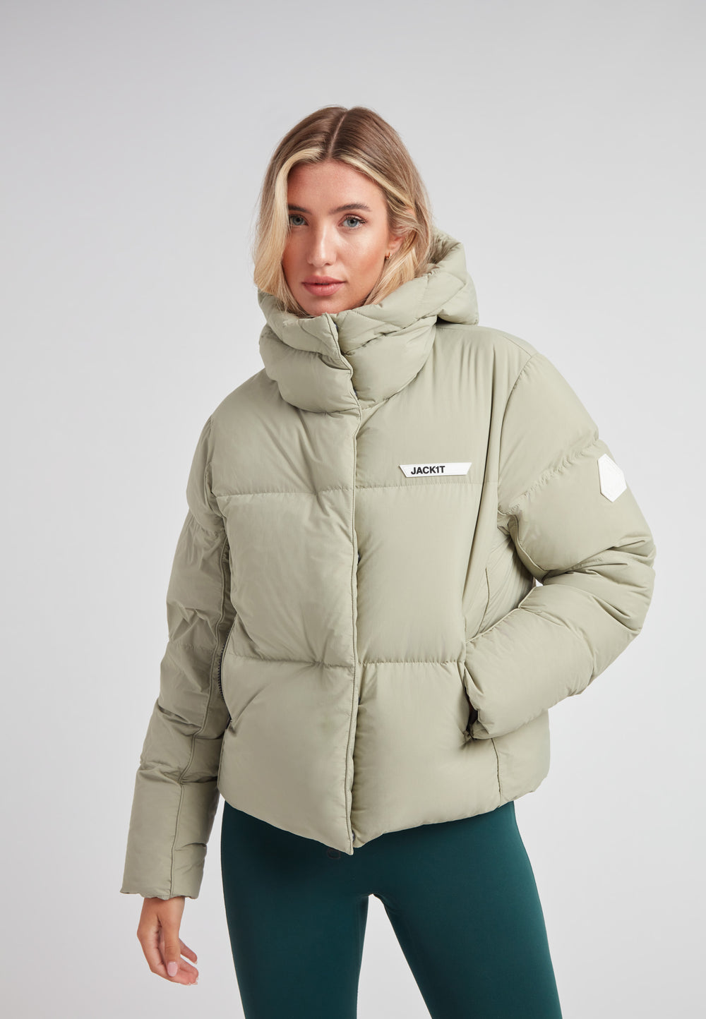 Star Shower Down Puffer Jacket Sage in soft green, featuring a cozy hood and contemporary design for winter wear.