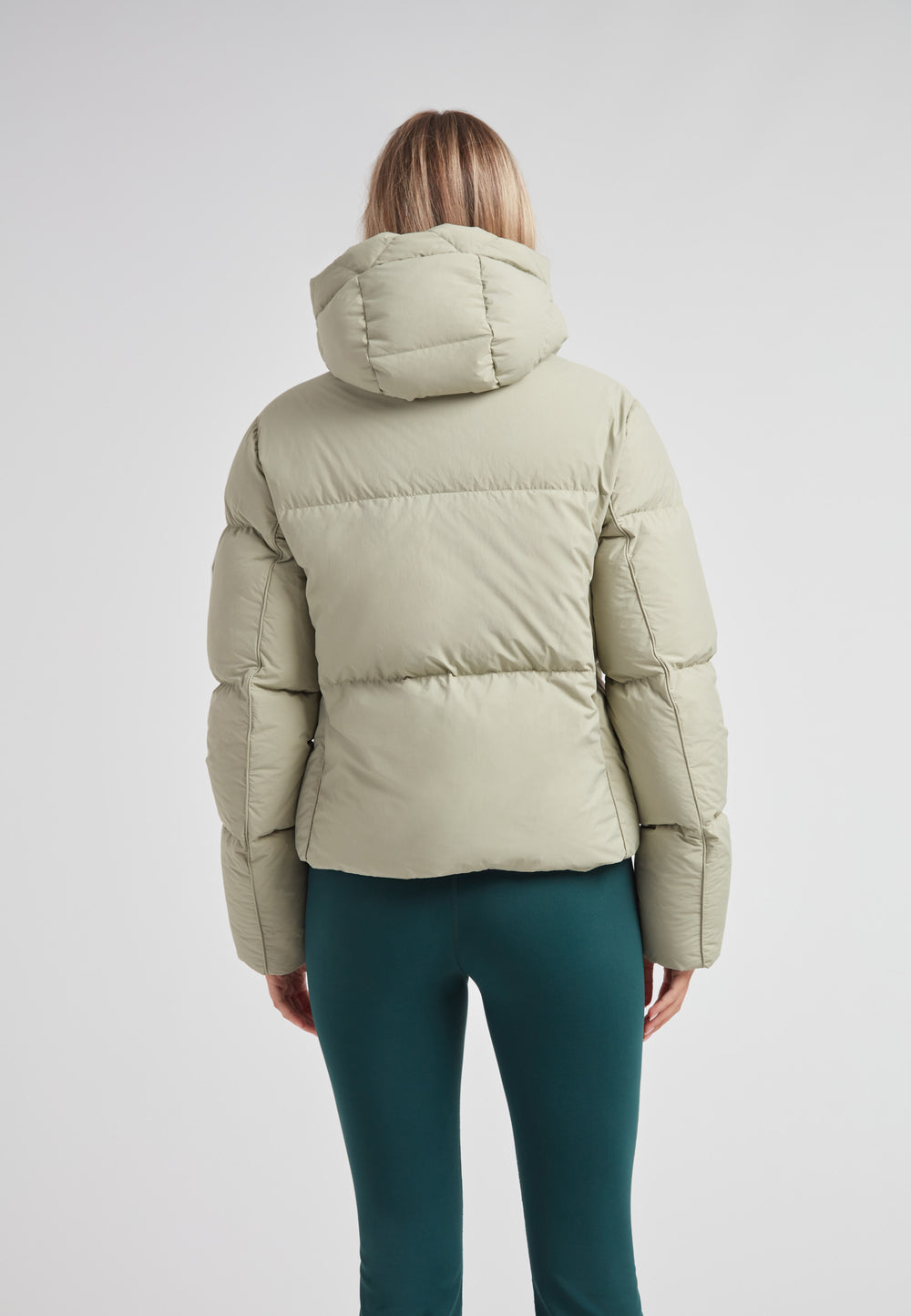 Back view of the Star Shower Down Puffer Jacket Sage showcasing its stylish and structured design.