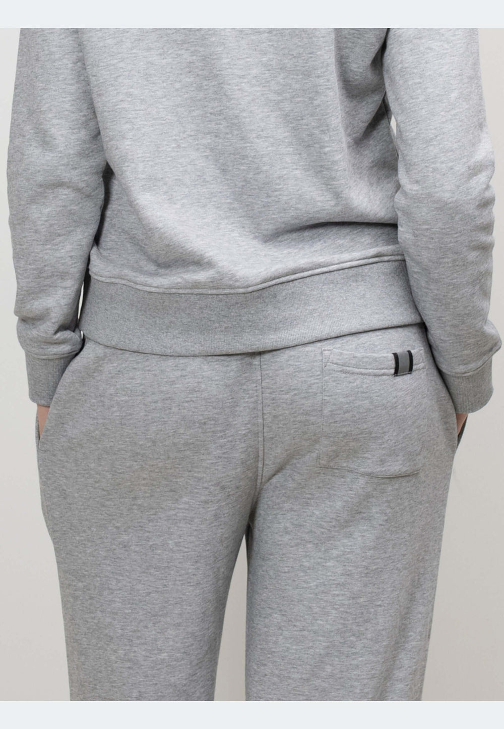 Back view of grey joggers showing relaxed fit and elastic waistband, perfect for everyday comfort.