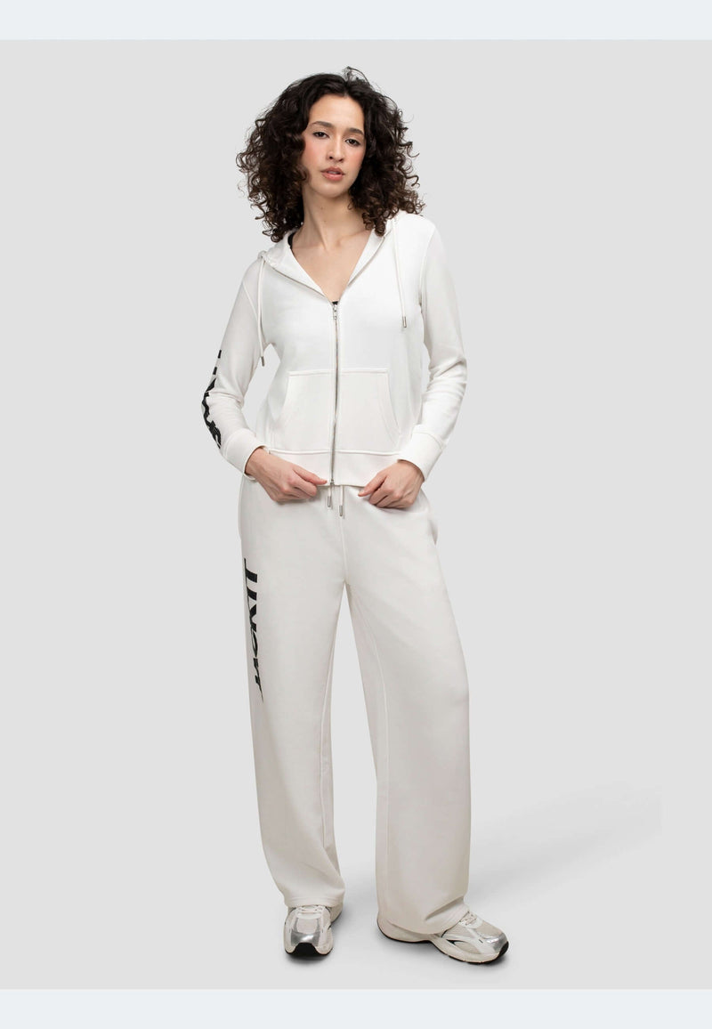 Model wearing off white joggers with a zip-up hoodie, showcasing a relaxed and stylish athleisure look.