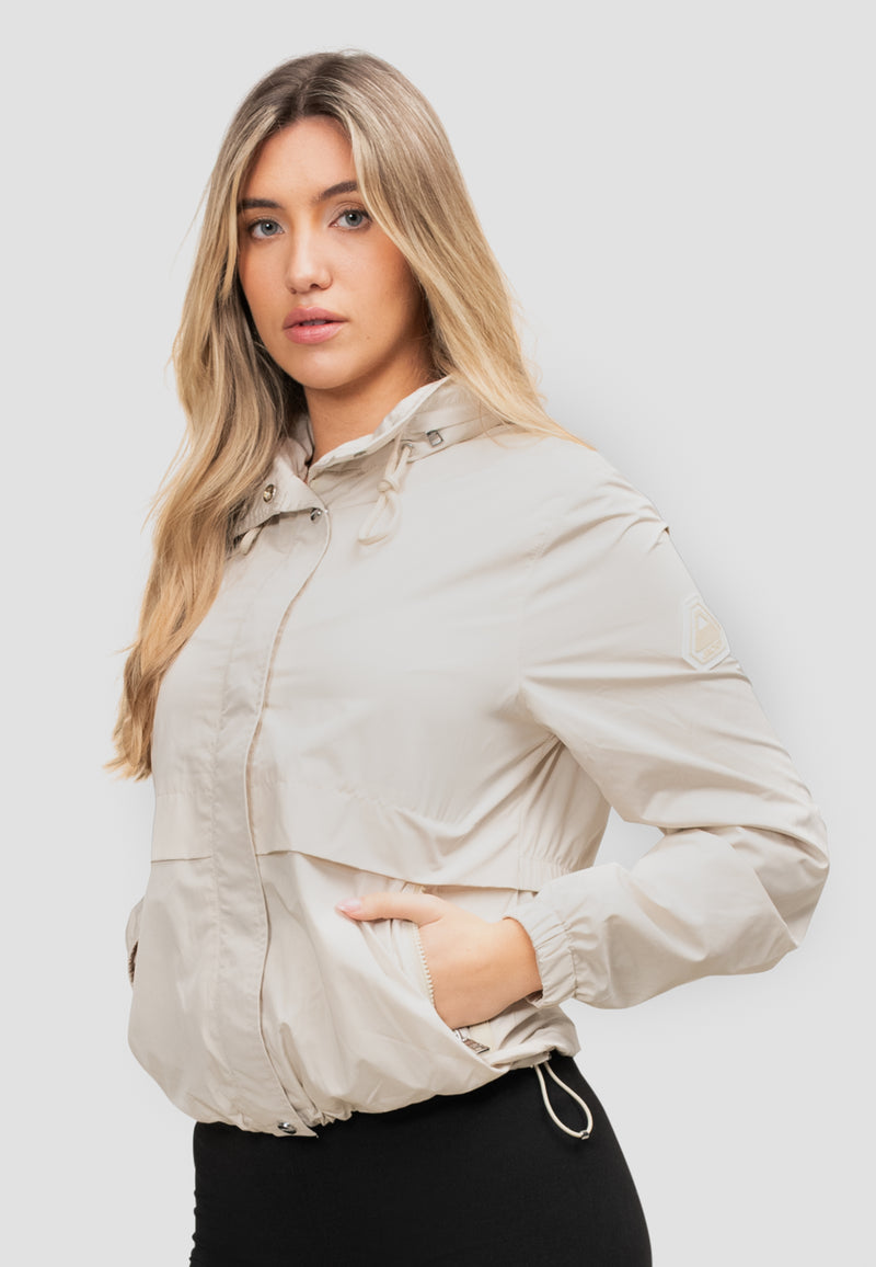Womens Lightweight Windbreaker in Cream featuring roll out hood and elasticated cuffs and hem.