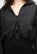 Ladies Cropped Black Jacket with adjustable hood and zip pockets, featuring a lightweight, water-resistant design.