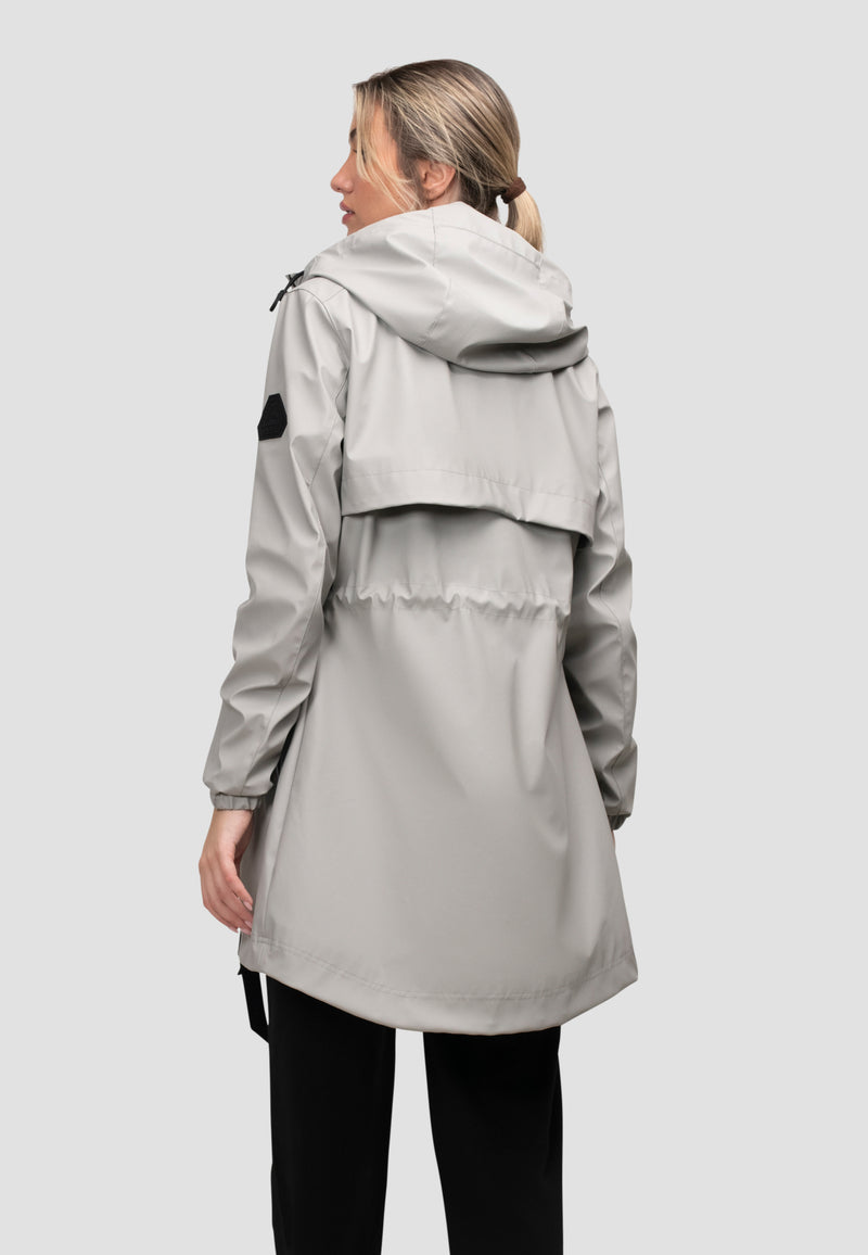 Back view of a lightweight women's grey raincoat with cape design in dusty light grey, perfect for unpredictable weather.
