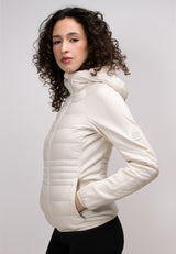 Womens Hybrid Hooded Jacket in Cream, featuring lightweight water-resistant fabric and fleece backed sleeves.