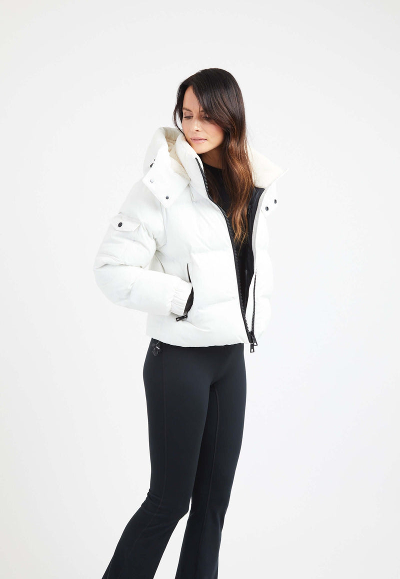 Model wearing a stylish EZ Bonded Cropped White crop puffer jacket women, featuring a hood and sleek design.
