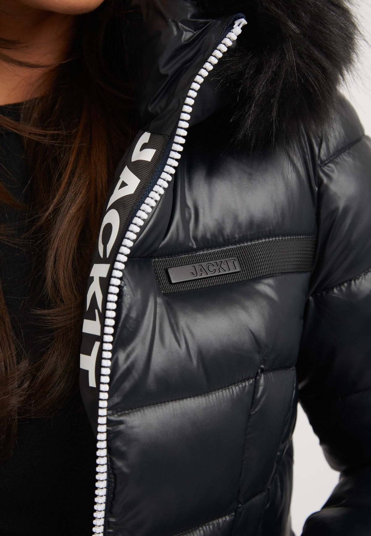 Close-up of the R4D Tricolore Racer Jacket Black, showcasing the fur trim and branding details, ideal for a black womens puffer jacket.